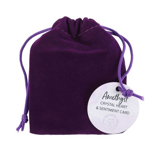A deep purple velvet drawstring pouch with an Amethyst Crystal Heart & Sentiment Card tag. This healing crystal promotes emotional balance, stress relief, and spiritual clarity, making it a thoughtful gift for mindfulness, meditation, and energy healing.