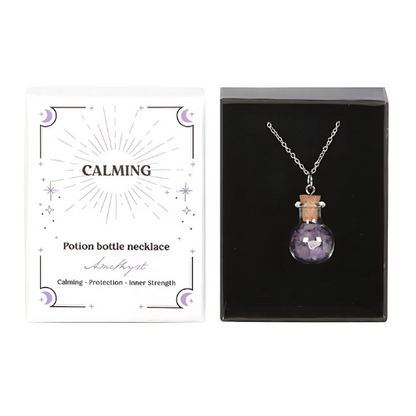 A Amethyst crystal chip bottle necklace in a mystical gift box, offering calming energy, protection, and emotional balance