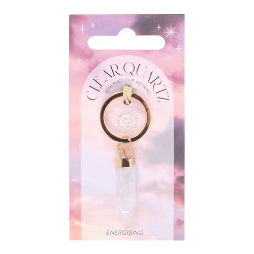 A Clear Quartz Semi-Precious Crystal Keyring with gold-tone accents, displayed on celestial-themed packaging. This high-vibrational crystal enhances energy, promotes clarity, and serves as a personal talisman for protection, intention setting, and manifestation.