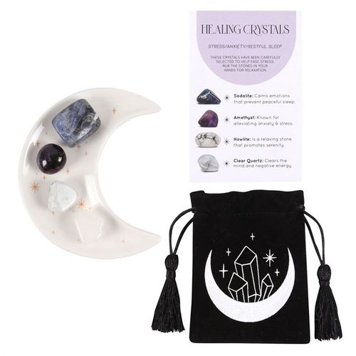 A healing crystal set for stress, anxiety, and restful sleep, featuring Sodalite, Amethyst, Howlite, and Clear Quartz. Includes a celestial moon-shaped trinket dish and a black velvet pouch with a crystal-inspired design. Perfect for relaxation, mindfulness, and energy healing.