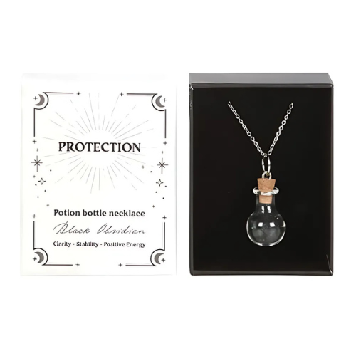  The Black Obsidian protection necklace displayed with its packaging, featuring a potion bottle pendant filled with grounding crystal chips.