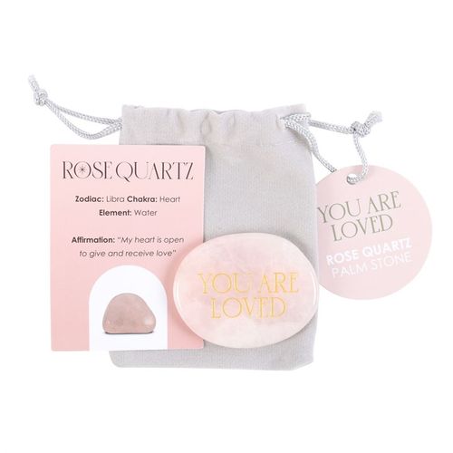 A Rose Quartz Palm Stone engraved with "You Are Loved," presented with an affirmation card and a soft grey drawstring pouch. Designed to promote love, emotional healing, and heart chakra balance. A meaningful self-care and spiritual gift.