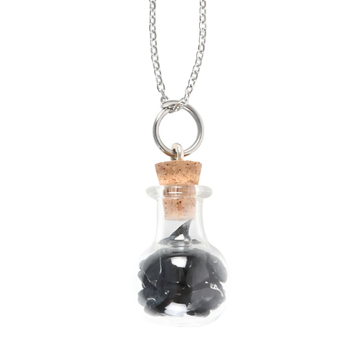  A close-up of the Black Obsidian potion bottle necklace, featuring natural crystal chips in a delicate glass vial pendant.